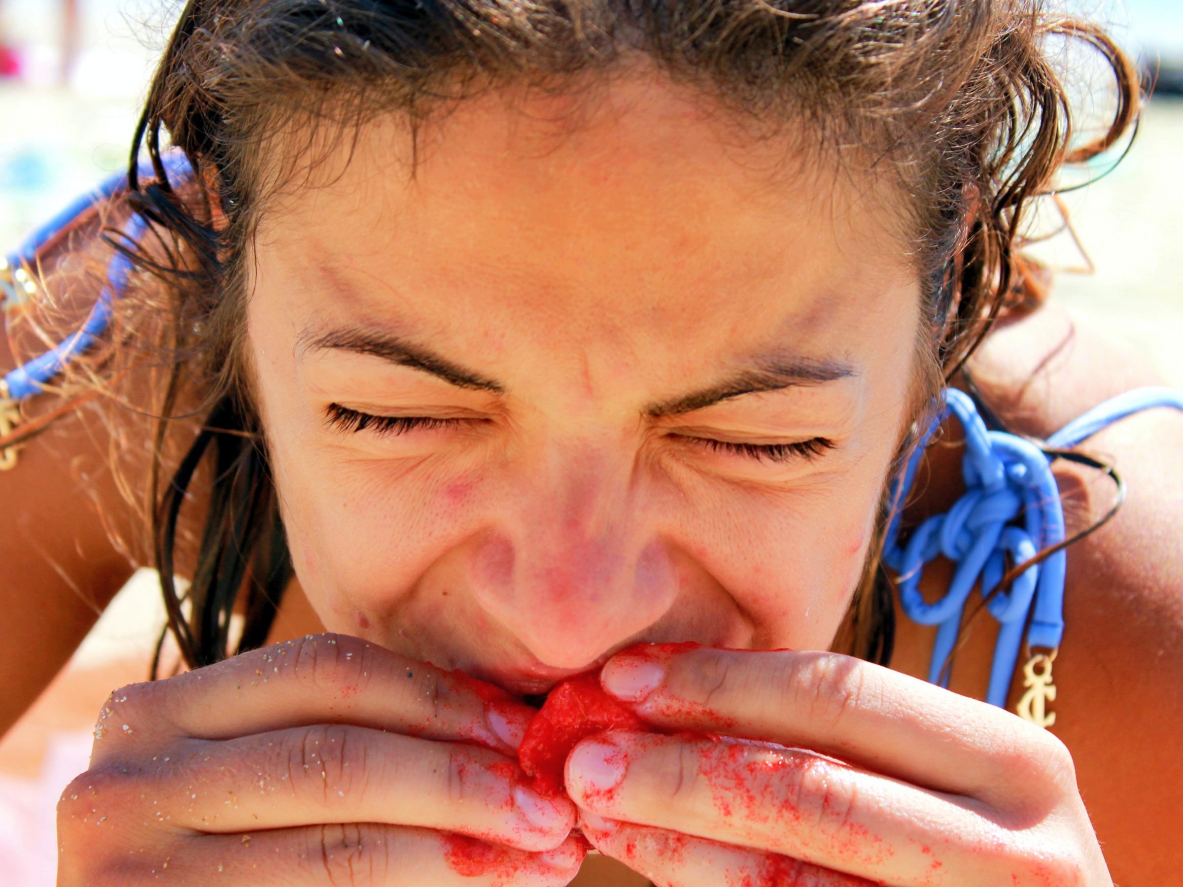 woman eating red paint